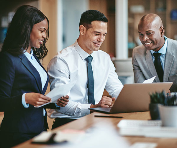 3 people looking at documents